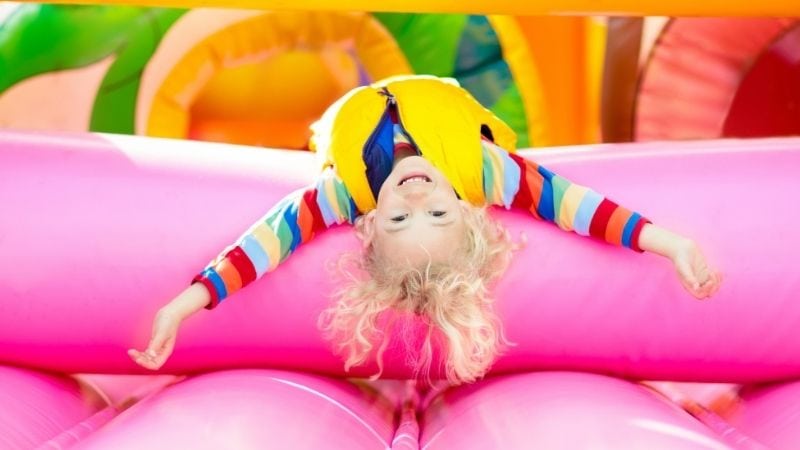 Colorful inflatable bounce house for kids play and indoor entertainment.