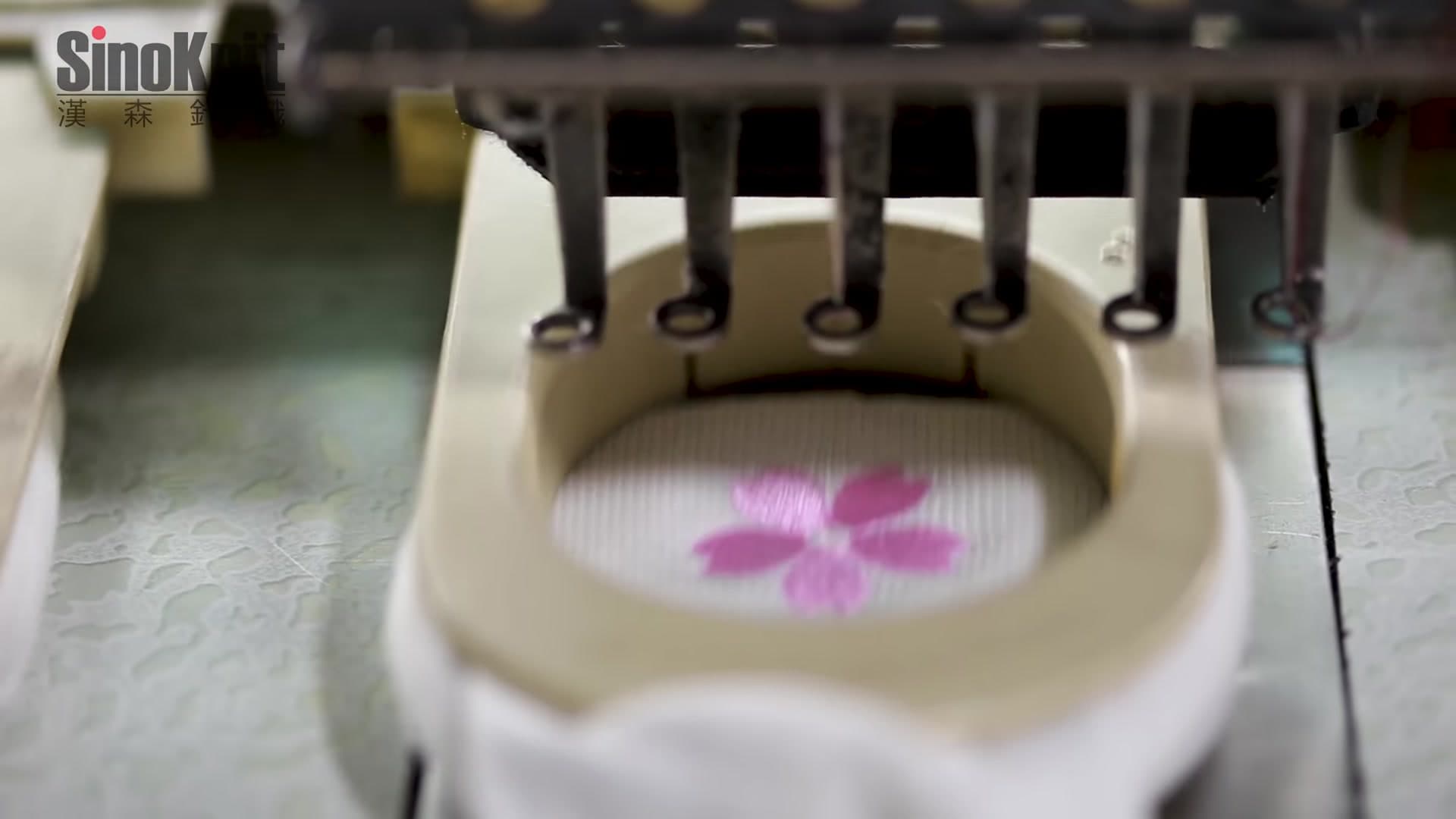 Embroidery machine stitching logos on socks